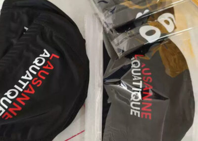 Bonnets de bain en tissu personnalisés et emballés individuellement sous blister